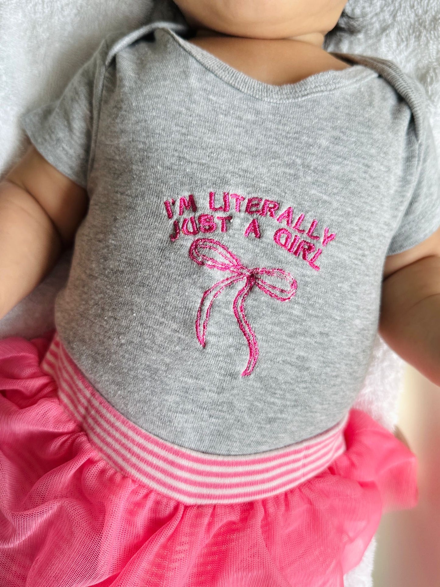 “I’m Literally Just a Girl” Embroidered Baby Onesie – Pink on Grey